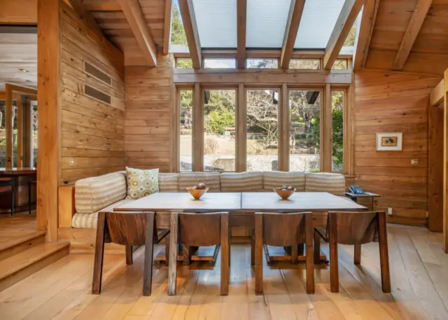 Inside the Upscale-Rustic Ranch of Movie Mogul Robert Daly, Co-Chairman of Warner Bros. 9 Dining room with large windows overlooking the ranch