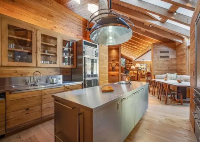 Inside the Upscale-Rustic Ranch of Movie Mogul Robert Daly, Co-Chairman of Warner Bros. 7 Bright, naturally lit kitchen with upscale fixtures