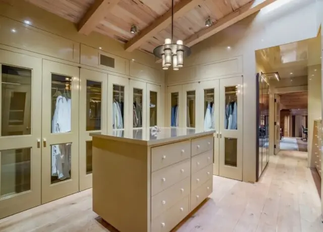 Inside the Upscale-Rustic Ranch of Movie Mogul Robert Daly, Co-Chairman of Warner Bros. 14 Large organized walk-in closet in the master suite