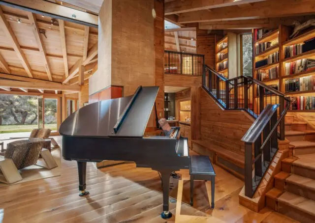 Inside the Upscale-Rustic Ranch of Movie Mogul Robert Daly, Co-Chairman of Warner Bros. 10 Wooden staircase with embedded bookcase