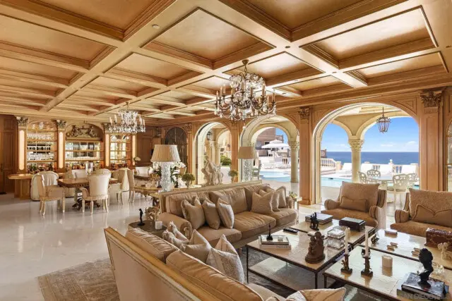 Inside the San Diego Mansion of Billionaire Entrepreneur Darwin Deason 7 Living space connecting seamlessly to a bar and outdoor patio