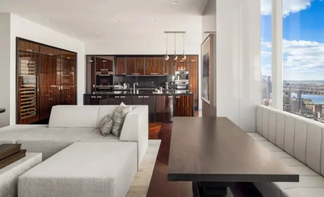 Inside the Toothsome Home of Entrepreneur and Shark Tank Star Robert Herjavec 9 Custom banquette seating overlooking city views in Robert Herjavec’s stylish condo