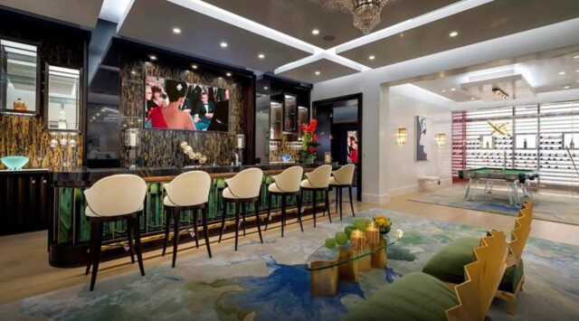 Chic home bar and game room in Michael Amini’s home 