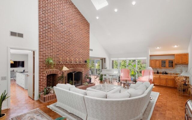 Rustic Bryn Mawr living room, exposed brick, fireplace 