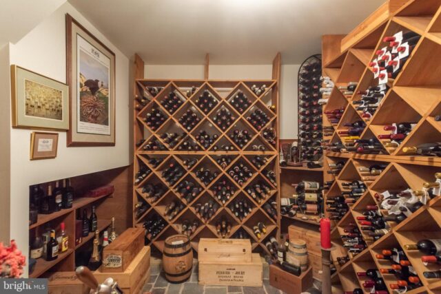 Bryn Mawr wine cellar featuring extensive collection on wine racks 