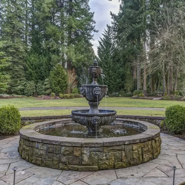 Decorative fountain at the entrance of the Kupp home, showcasing luxury and elegance.