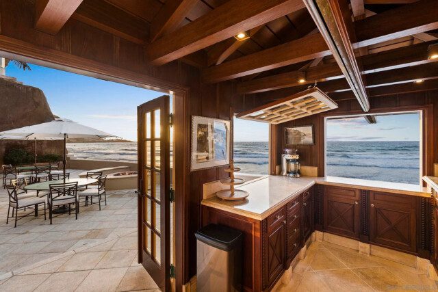 Outdoor bar with seating and ocean view, perfect for entertaining