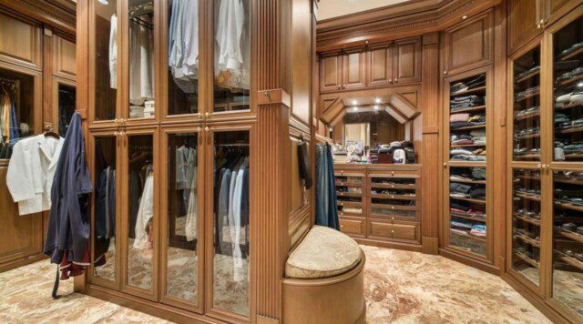 A spacious and organized master closet belonging to entrepreneur George Foreman. 