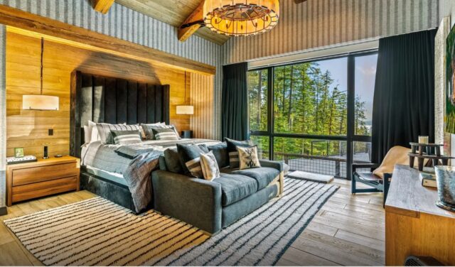 Serene master bedroom with a view of the rural Idaho woods