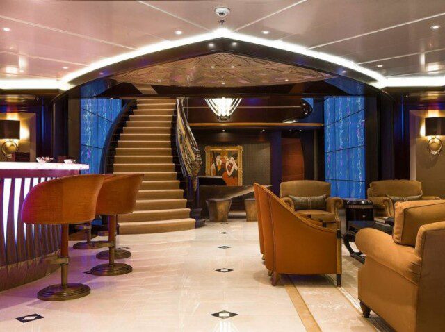 Elegant curved staircase leading below deck on the Kismet
