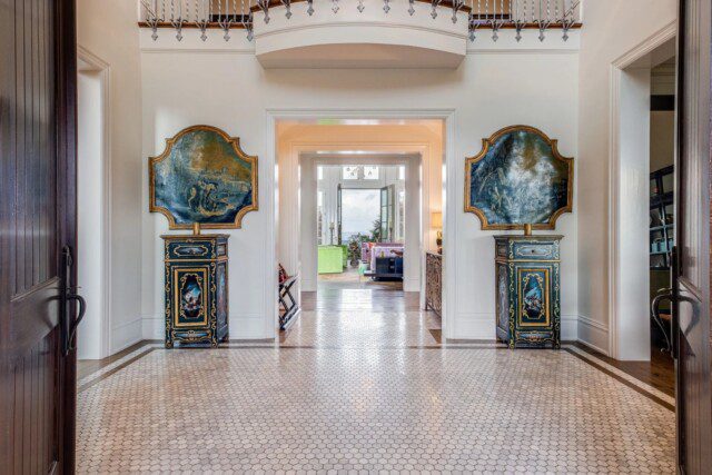 Grand entryway of Dave Ramsey’s Tennessee home, featuring a spacious and elegant design. 