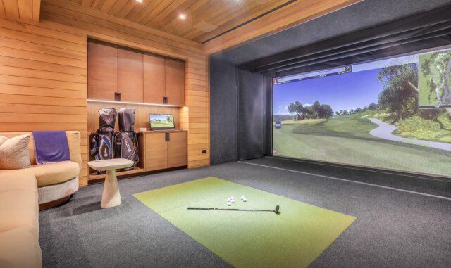 Indoor golf simulator in Russell Weiner’s home, designed for year-round use. 